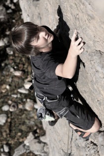 Physically Fit Middle School Age Boy Doing Some Serious Rock Climbing.  Photo by Marcus Caston.